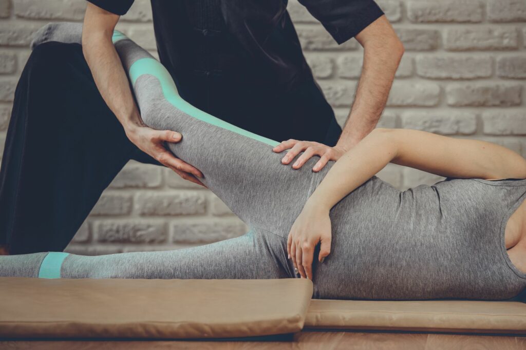 Person receiving a pregnancy massage near Atlanta, GA